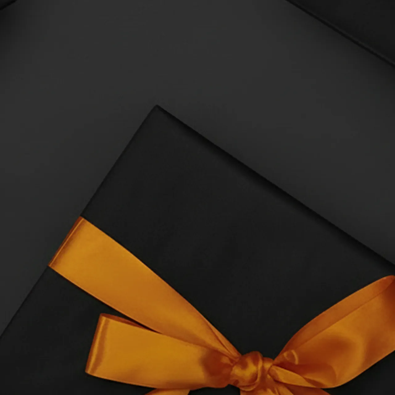 Black gifts adorned with vibrant orange ribbons on a dark background.