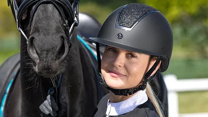 Girl wearing a riding helmet