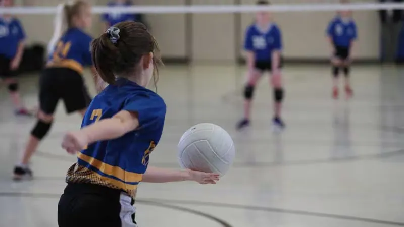 Young girl playing volleyball