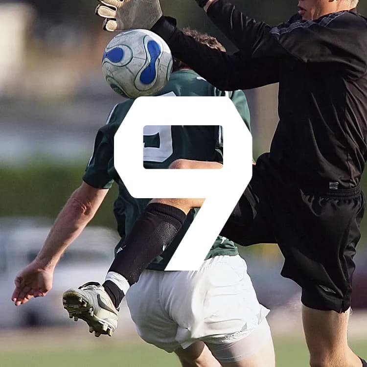 Soccer player in green jersey collides with a goalkeeper while attempting a header, with a large white number 9 overlaid on the image.