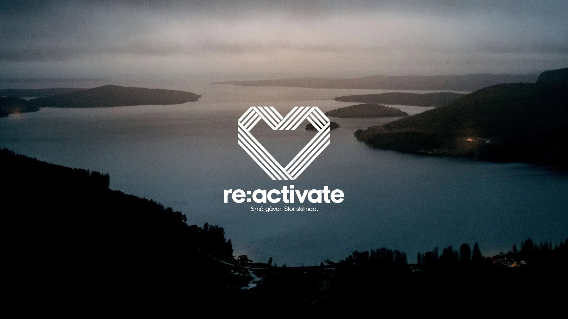A tranquil lake at dusk surrounded by hills, overlaid with a "re:activate" logo featuring a heart design.