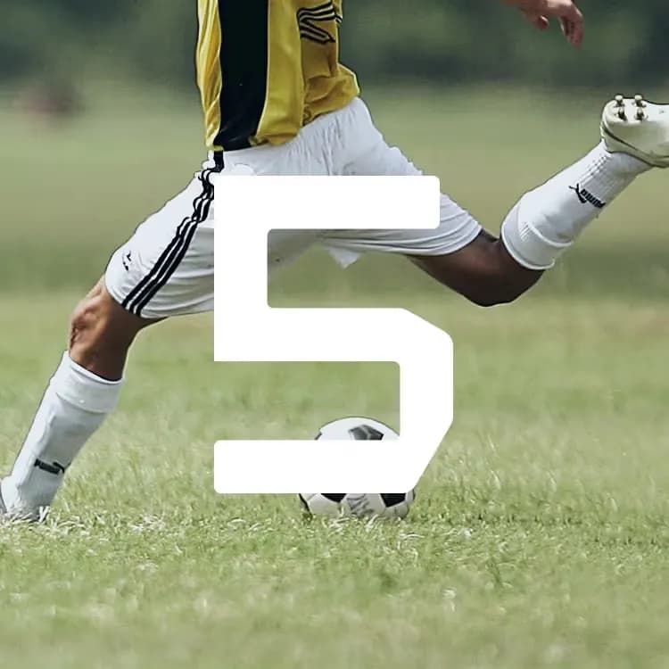A soccer player in a yellow jersey and white shorts kicks a ball on a grassy field. A large white number 5 overlays the image.
